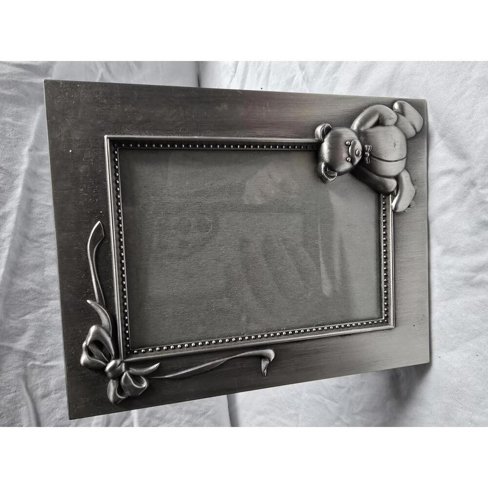 Decorative Silver Tone Photo Frame with Teddy Bear Accent; holds 3 x 5 photo.
